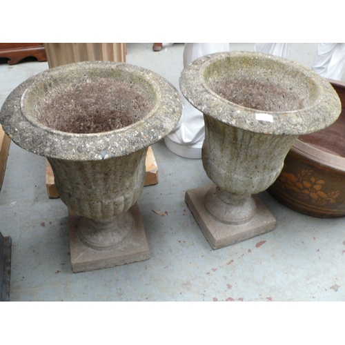 192 - Pair of concrete fluted urns with square bases - height 21 ins