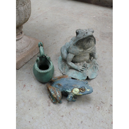 196 - Two metal frogs and a green patinated metal jug in the form of a gourd