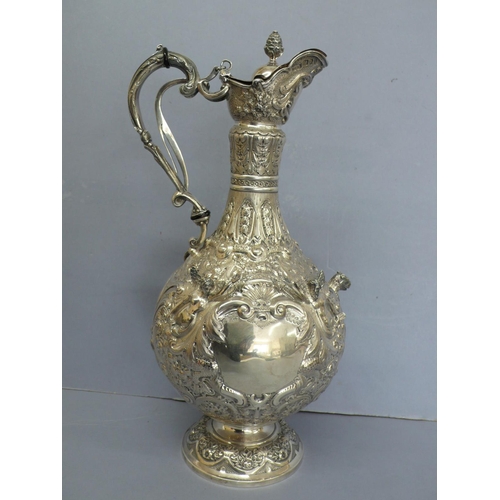 2 - Late Victorian chased silver claret jug with fir cone finial and decoration of angels and lion mask ... 