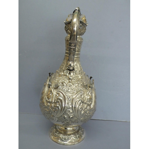 2 - Late Victorian chased silver claret jug with fir cone finial and decoration of angels and lion mask ... 