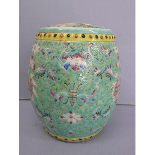 20 - Guangxu barrel shaped porcelain jar with cover (broken) having floral and feather decoration in mult... 