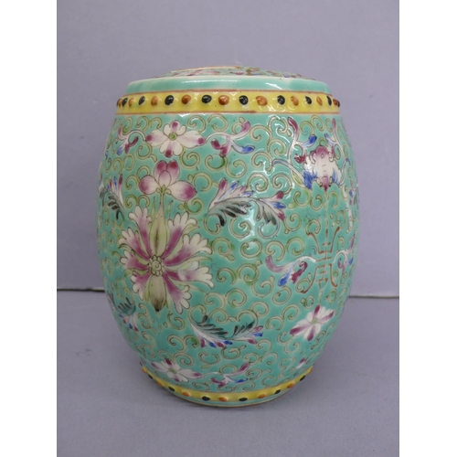 20 - Guangxu barrel shaped porcelain jar with cover (broken) having floral and feather decoration in mult... 