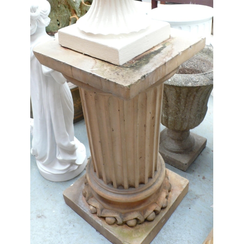 205 - A pair of terracotta columns on square bases - height 28.5 ins approx