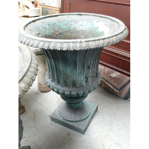 208 - A large pair of painted cast iron fluted garden urns - height 30 ins approx