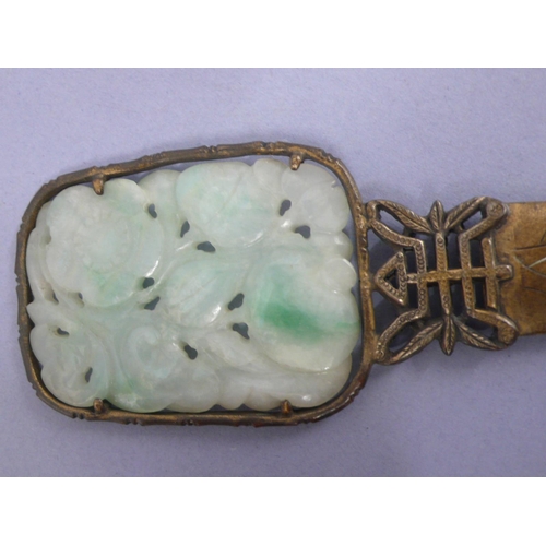 22 - 19th/20thC Chinese gilt metal letter opener with pale green carved pierced jade panel to top, showin... 