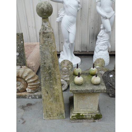 221 - A pair of carved stone obelisks with ball finials, square tapering column, four ball supports on ste... 