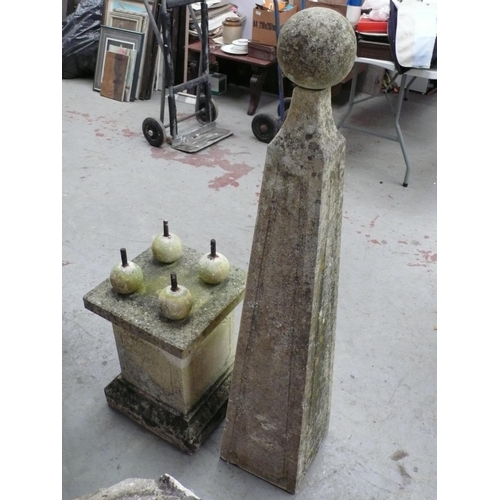 221 - A pair of carved stone obelisks with ball finials, square tapering column, four ball supports on ste... 