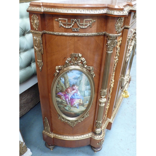 223 - A French quarter veneered gilt metal mounted walnut break fronted demilune side cabinet with oval pa... 