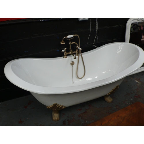 229 - A white enamel cast iron slipper bath on four paw feet, 72ins with brass old fashioned mixer and sho... 