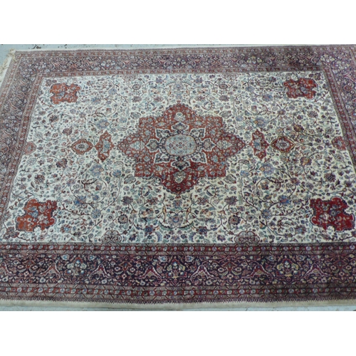 234 - Fine hand woven Persian carpet with eight borders, central medallion, floral decoration in mainly re... 