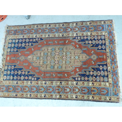 237 - A Middle Eastern handmade wool carpet with Geometric designs in multicoloured wools, 49x77ins