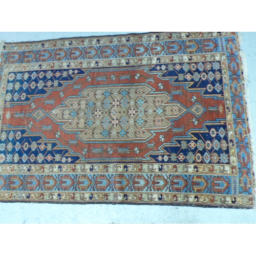 237 - A Middle Eastern handmade wool carpet with Geometric designs in multicoloured wools, 49x77ins