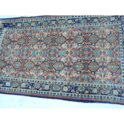 238 - Middle Eastern handmade wool carpet with floral designs in multicoloured wools, 49x91ins