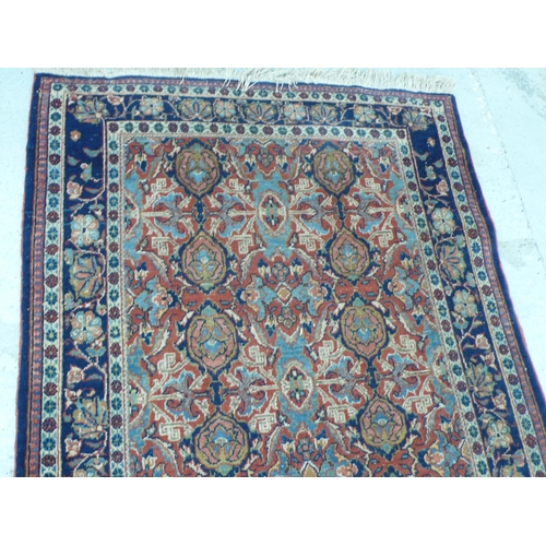 238 - Middle Eastern handmade wool carpet with floral designs in multicoloured wools, 49x91ins