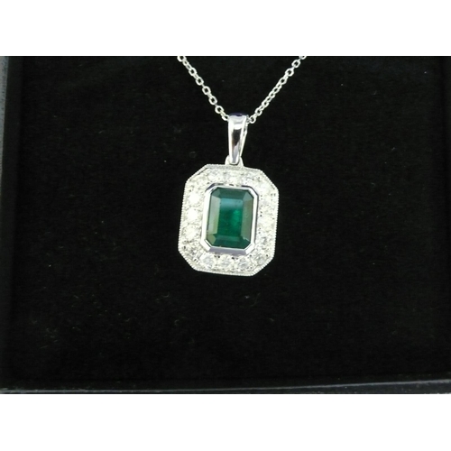 25 - 18ct gold pendant set with a square step cut emerald surrounded by diamonds