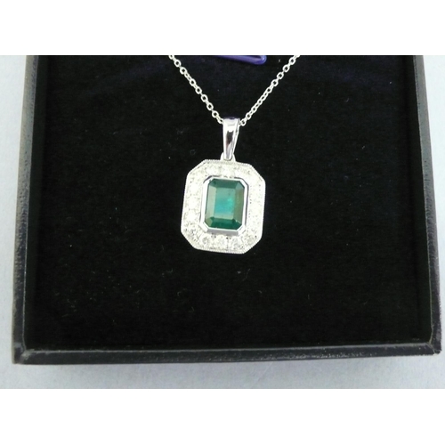 25 - 18ct gold pendant set with a square step cut emerald surrounded by diamonds