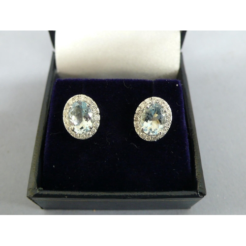 257 - 18ct white gold oval aquamarine and diamond cluster ear studs, aquamarines approx 2.5cts