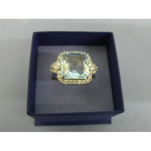 258 - 18ct white gold ring with large octagonal aquamarine surrounded by diamonds, aquamarine 8.6cts, with... 