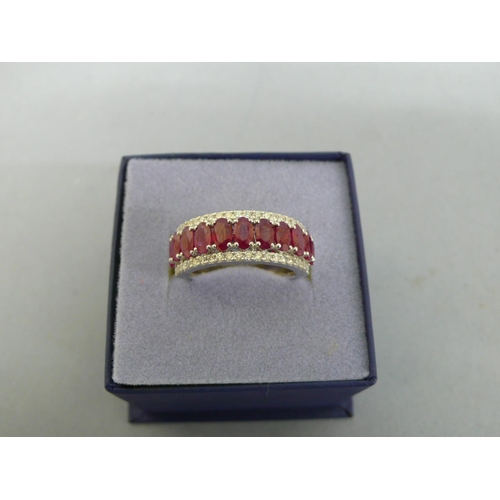 259 - Platinum oval ruby and diamond half hoop ring, size O