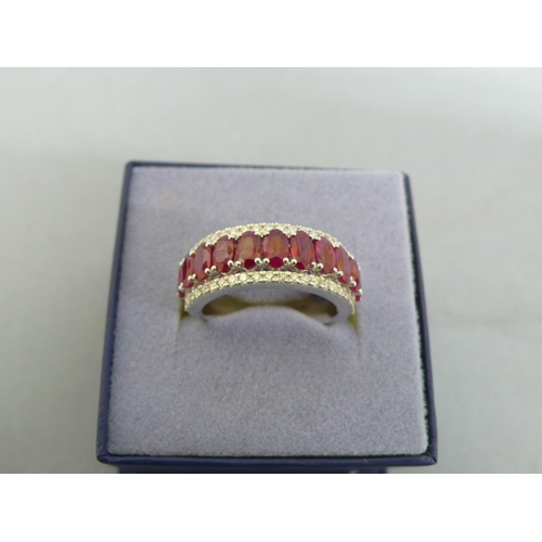 259 - Platinum oval ruby and diamond half hoop ring, size O