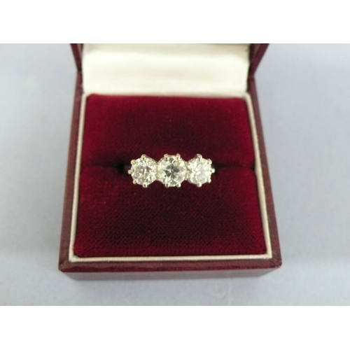 28 - Good three stone diamond ring set in platinum, approx 2cts diamonds, size O/P