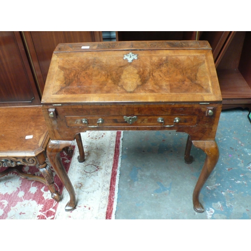 51 - A walnut bureau in the Georgian style with fall front, single drawer, cabriole legs and pad feet - w... 