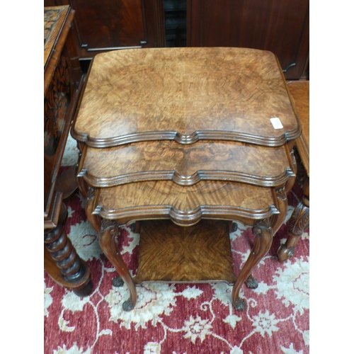 53 - A good quality nest of three walnut occasional tables