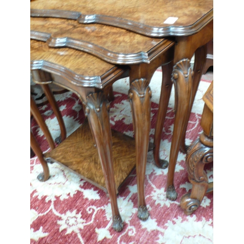 53 - A good quality nest of three walnut occasional tables