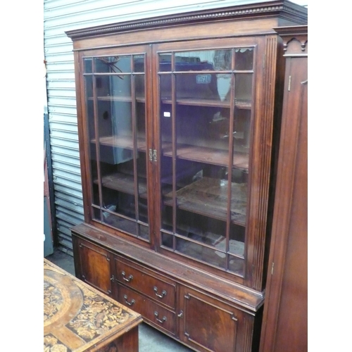 56 - A 19th/20thC mahogany bookcase glazed doors above two drawers, two cupboards, on square legs with  b... 