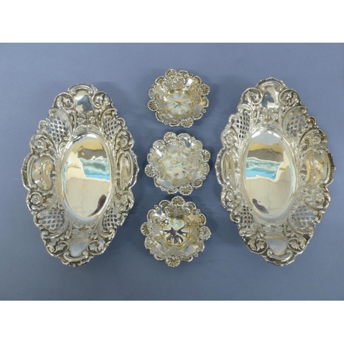 8 - Pair of Edwardian oval chased and pierced silver bonbon dishes, plus thee small dishes, Sheffield 18... 