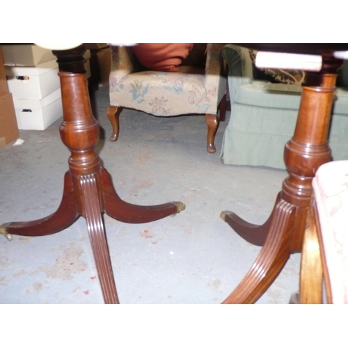 92 - A 19thC twin pedestal mahogany 'D' ended dining table with turned column and reeded sabre legs