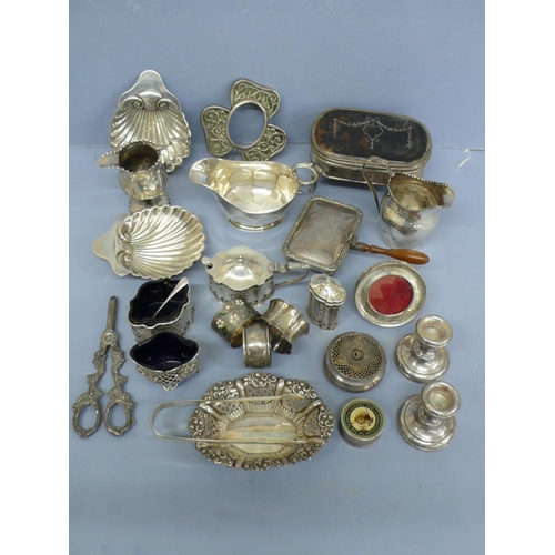 296 - A collection of Georgian and later silver dining table and dressing table items, weighable 34.5 ozt.