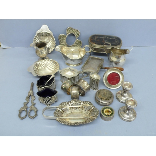 296 - A collection of Georgian and later silver dining table and dressing table items, weighable 34.5 ozt.