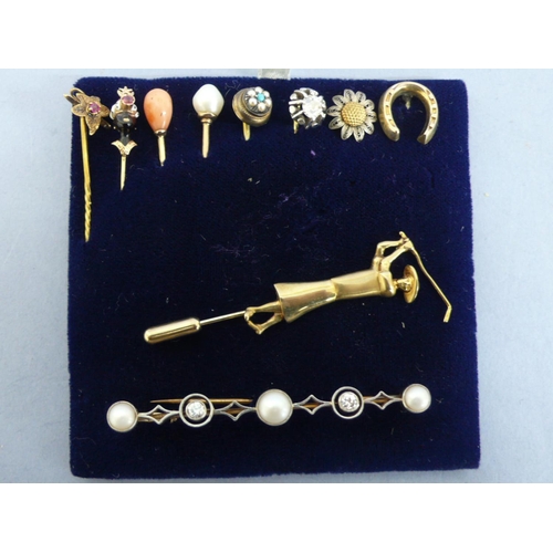 299 - Eight stick pins and two brooches 18, 15 & 9 ct. gold - ruby, diamond, pearl, coral, enamel, silver ... 