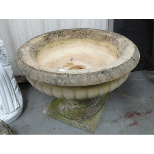 213 - A large carved stone campana urn - diameter 35 ins approx  height 36 ins approx (cracked)