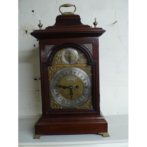 313 - 19thC mahogany bracket clock with carrying handle, silvered chapter rings, ormolu spandrels on brass... 