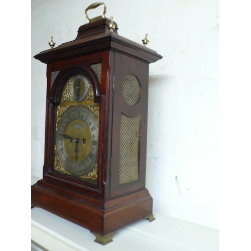 313 - 19thC mahogany bracket clock with carrying handle, silvered chapter rings, ormolu spandrels on brass... 