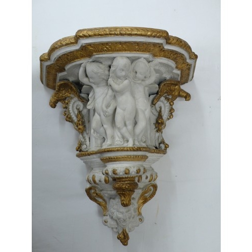 314 - Victorian painted plaster bracket with decoration of Putti, Eagles, fruit and a mask, height 13.5ins