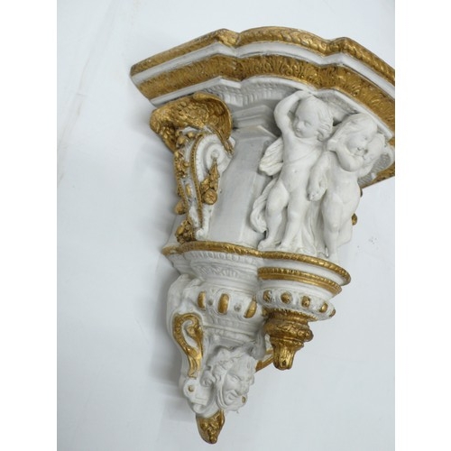 314 - Victorian painted plaster bracket with decoration of Putti, Eagles, fruit and a mask, height 13.5ins