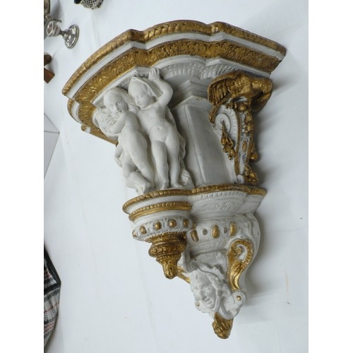 314 - Victorian painted plaster bracket with decoration of Putti, Eagles, fruit and a mask, height 13.5ins