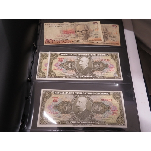 A folder of worldwide bank notes
