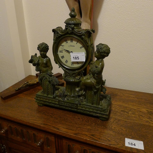 185 - A reproduction bronze look classical style mantel clock with two cherubs (located in room 51)