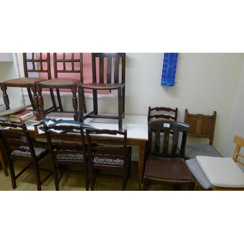 243 - A quantity of miscellaneous furniture including two desks,  a table and 10 chairs (located in kitche... 