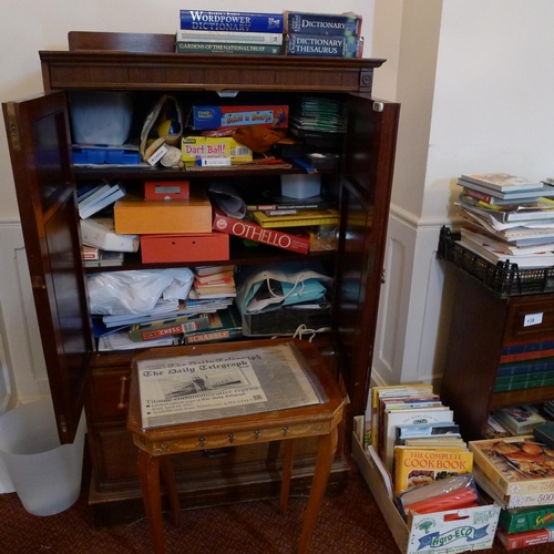 138 - Two mahogany a cabinets containing a quantity of miscellaneous books, videos and games etc (located ... 