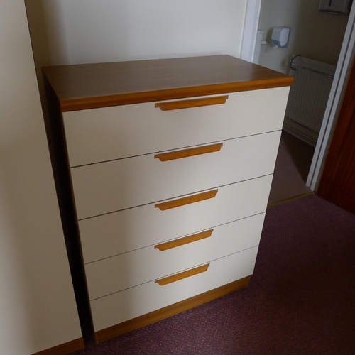 35 - A single bed with mattress, a modern light wood wardrobe with matching chest of drawers and a small ... 