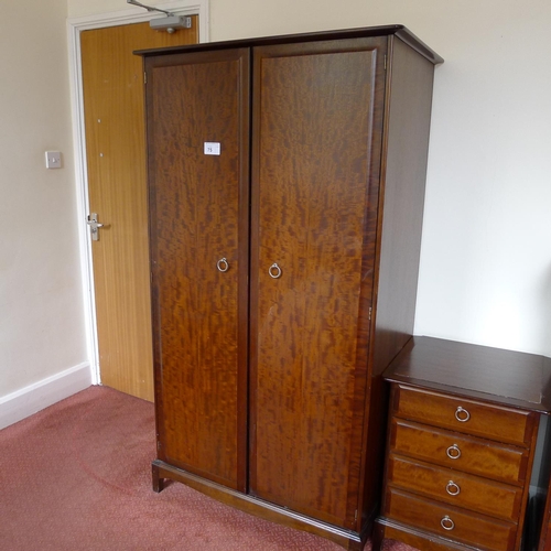 75 - A dark wood 3 piece bedroom suite comprising; a wardrobe and two chests of drawers and a single bed ... 