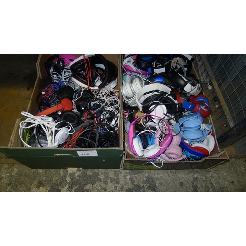 235 - A large quantity of headphones and earphones including Sony, Philips etc contents of two boxes - tra... 