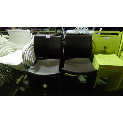 39 - 16 Brown plastic stacking chairs