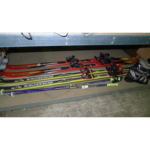 88 - 2 pairs of skis, 1 pair of poles and 1 pair of ski boots