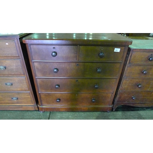 703 - A Victorian mahogany bedroom chest of two short and three long drawers with turned knobs